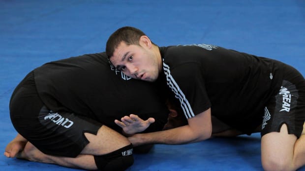 ZY. How to Do an Anaconda Choke or Gator Roll MMA Submission Promo Image