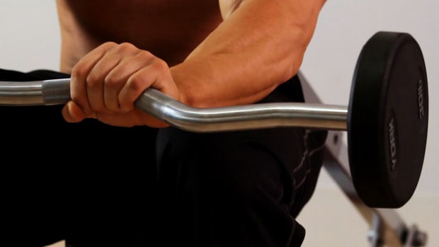 S. How to Do a Barbell Forearm Extension for an Arm Workout Promo Image