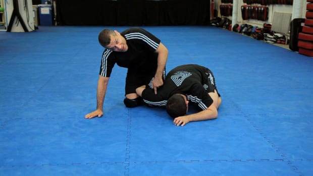 ZV. How to Do a Reverse Omoplata MMA Submission Promo Image