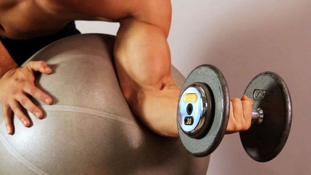 ZJ. How to Do a Swiss Ball Preacher Curl for an Arm Workout Promo Image