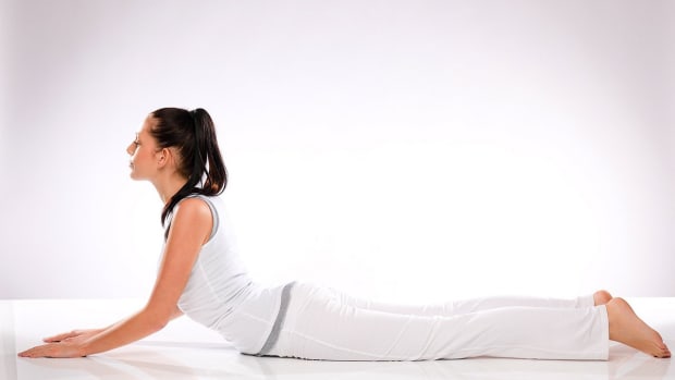 E. How to Do a Prone Quad Stretch for Sexy Legs Workout Promo Image