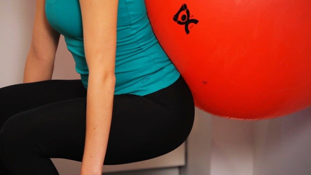 K. How to Do a Wall Squat with an Exercise Ball Promo Image