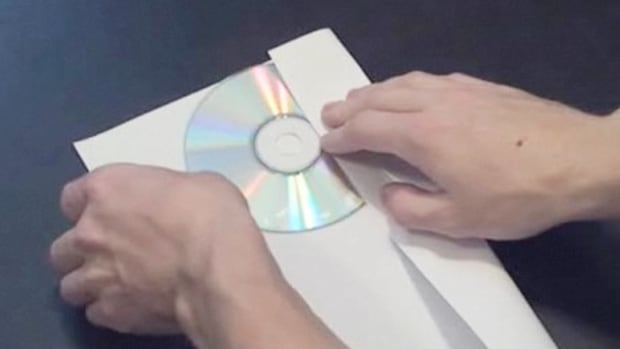 U. How to Make a CD or DVD Case Out of a Piece Of Paper Promo Image