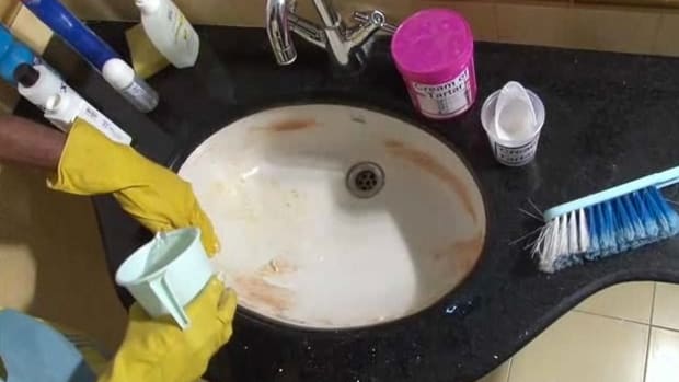 A. How to Remove a Red-Brown Rust Stain from a Bathroom Sink Promo Image