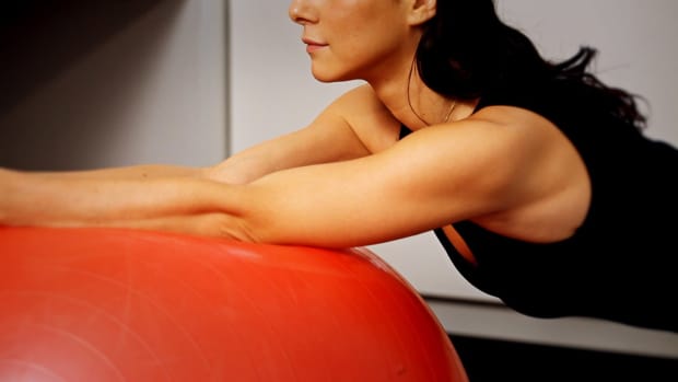 F. How to Do a Swiss Ball Stabilizing Exercise for Back Pain Promo Image