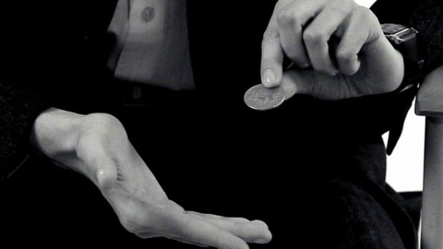 G. How to Thumb Palm a Coin Promo Image