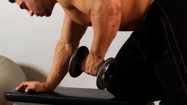 X. How to Do a Dumbbell Kick for an Arm Workout Promo Image
