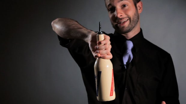 J. How to Do an Arm around the Head Grip Change Bartending Move Promo Image
