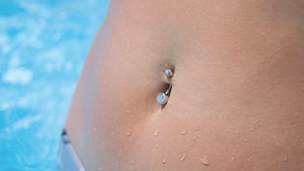 L. What Is a Belly or Navel Piercing? Promo Image