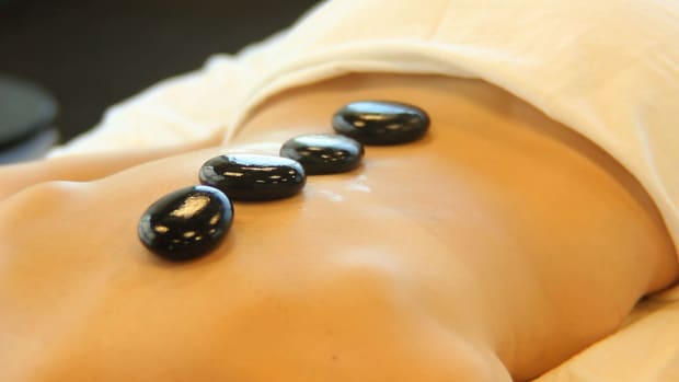A. What Is Hot Stone Massage Therapy? Promo Image