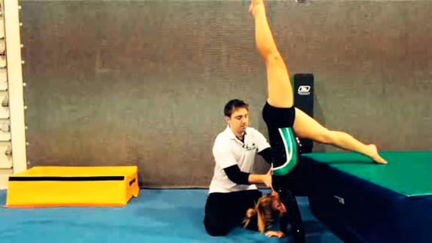 F. How to Do a Handstand Push-Up in Gymnastics Promo Image