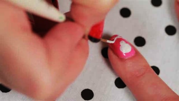 Q. How to Create a Skull and Crossbones Nail Art Design Promo Image