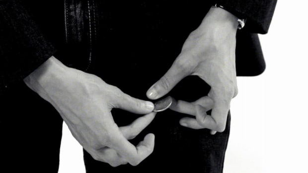 R. How to Do the Coin through the Pocket Trick Promo Image