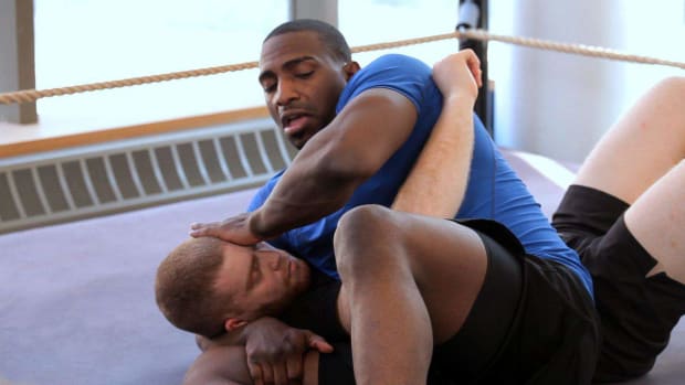 F. How to Do a Knee Bar from Scarf Hold Leg Lock Promo Image