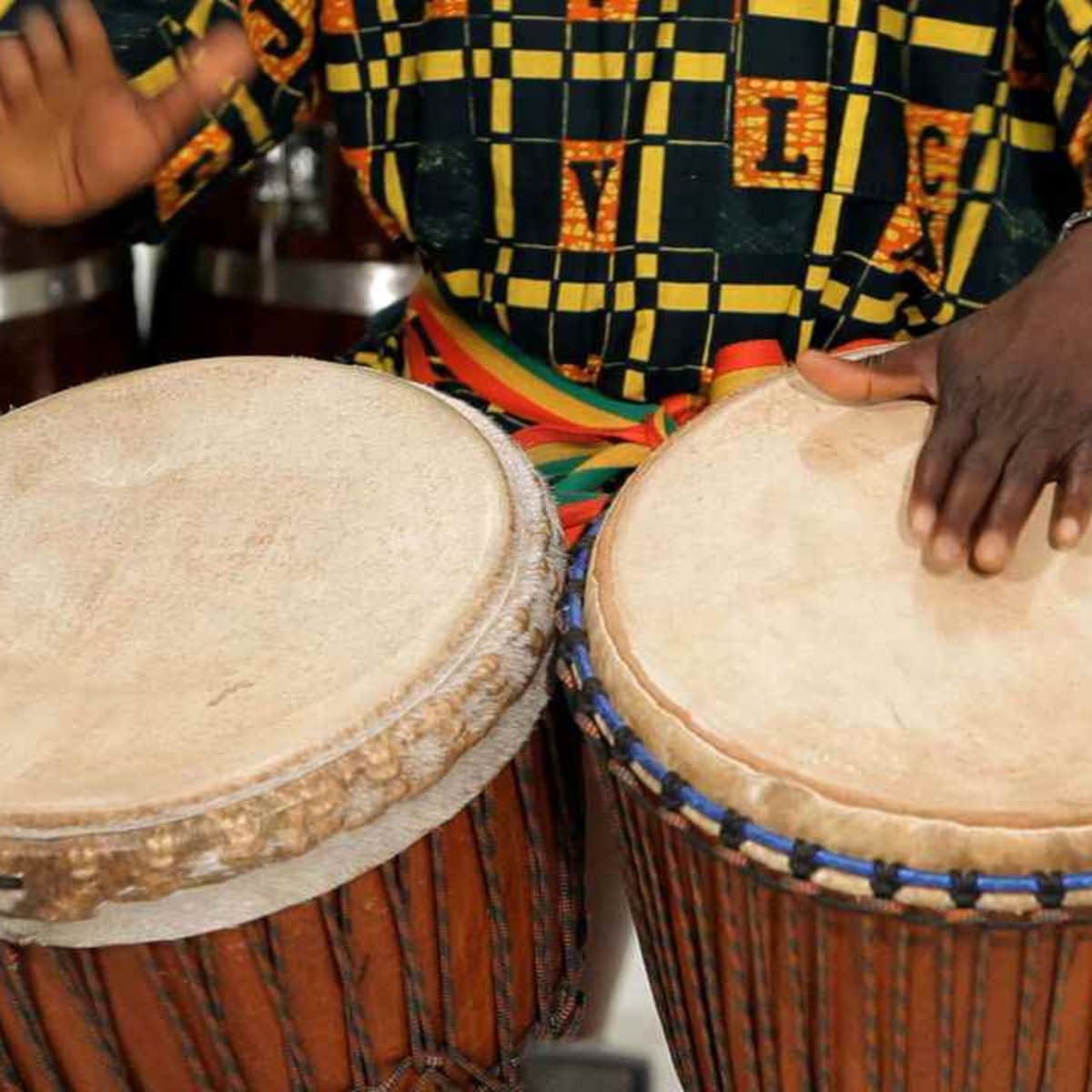 How to Play 2 Djembe Drums Together - Howcast