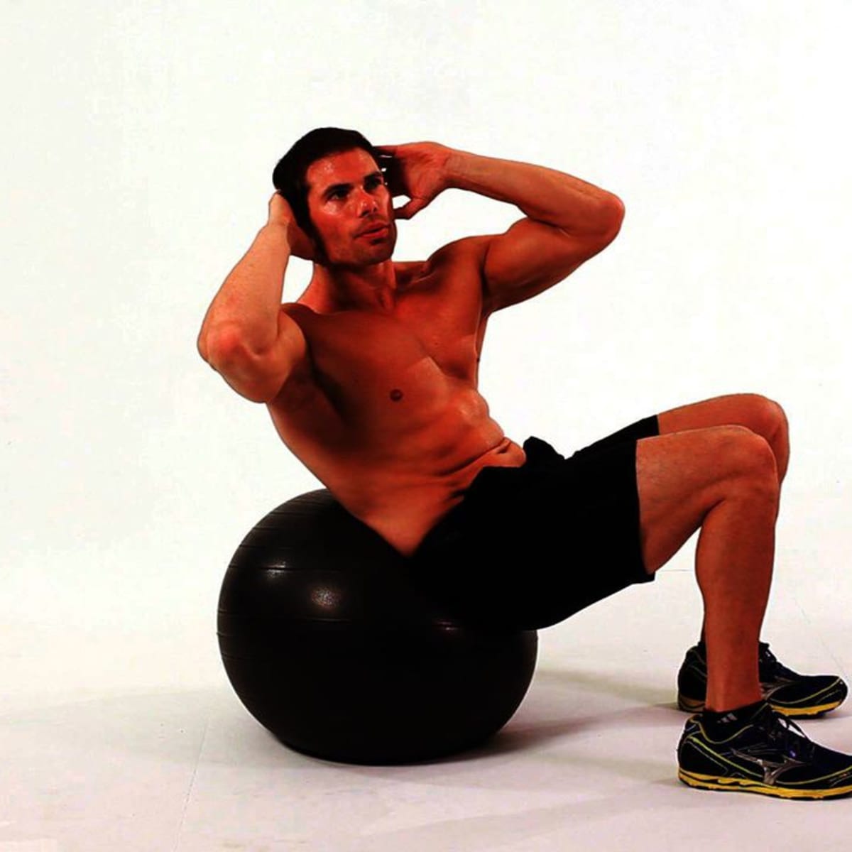 How to Do Swiss Oblique Crunch on Exercise Ball Howcast