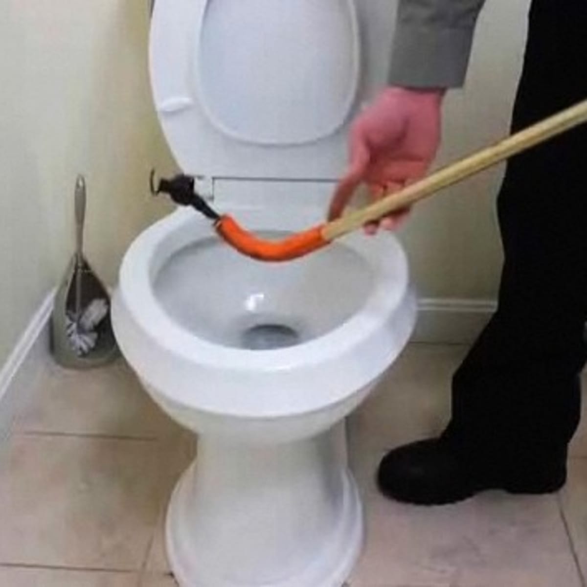 How to Clear a Clogged Toilet with a Closet Auger Howcast