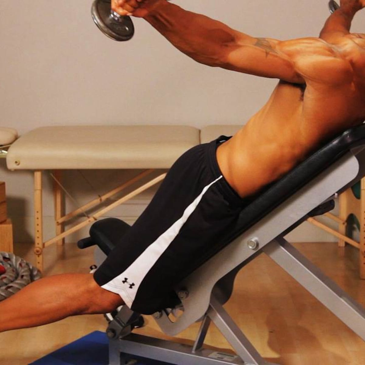 How to Do a Seated Reverse Fly for a Back Workout Howcast