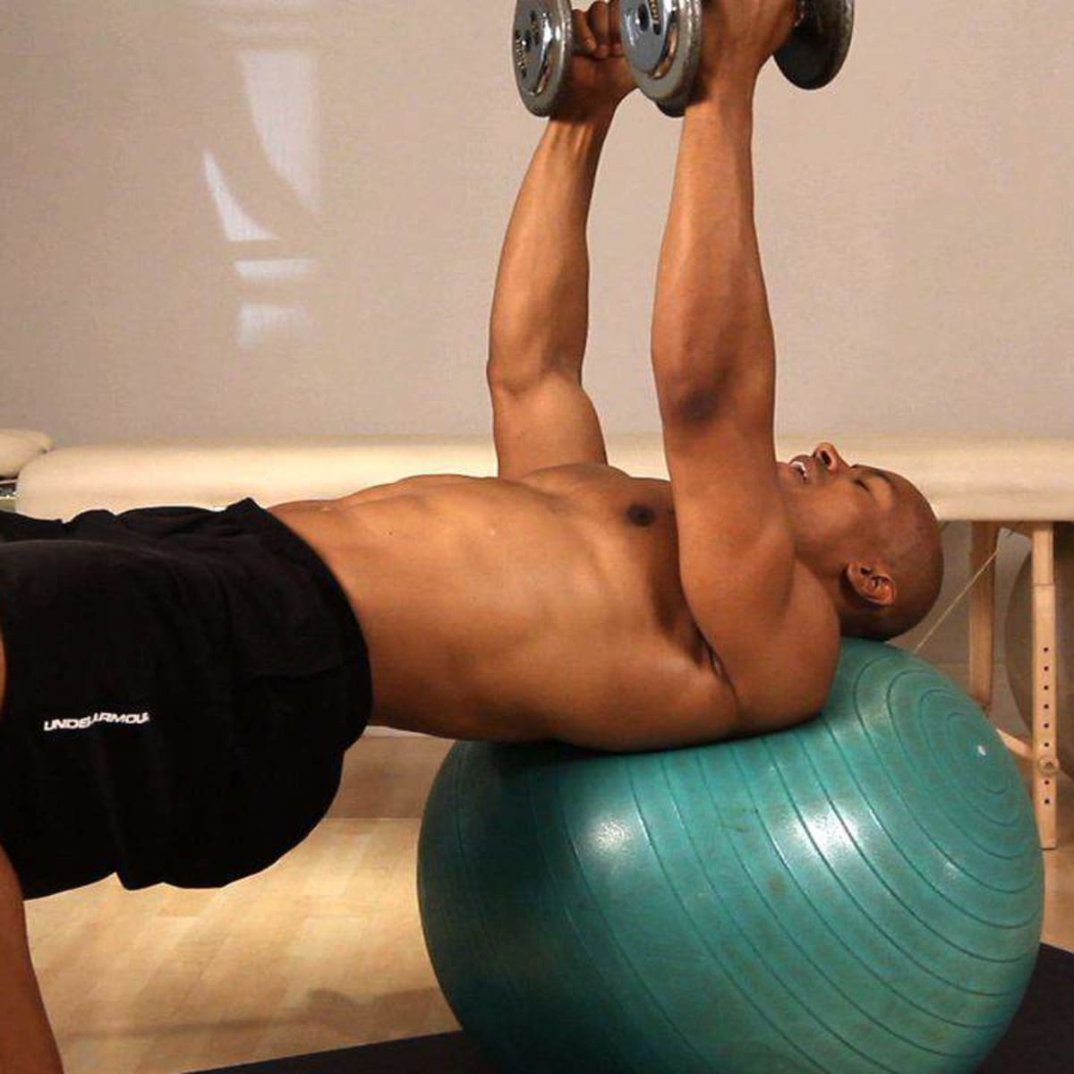 How to Do an Exercise Ball Flat Dumbbell Fly Howcast