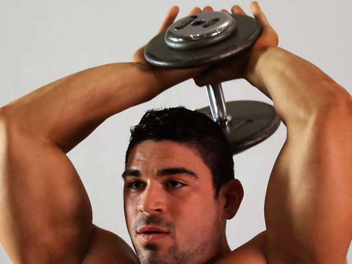 How to Do a Swiss Ball Dumbbell Overhead Extension Howcast