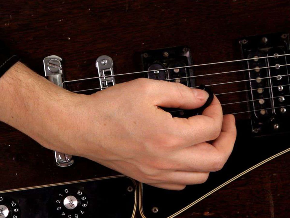 How to Hold a Guitar Pick Correctly Howcast