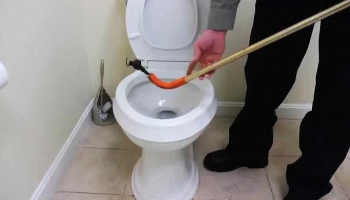 How to Clear a Clogged Toilet with a Closet Auger Howcast
