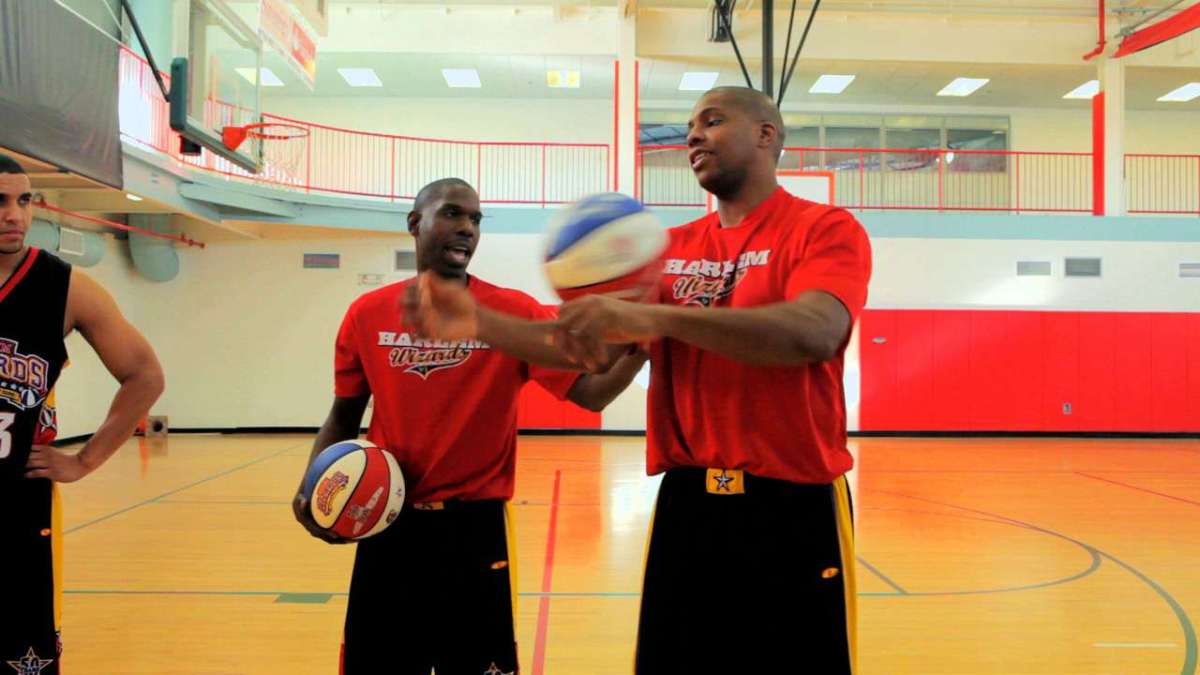 How to Do the Rolling around the Arm Basketball Trick Howcast