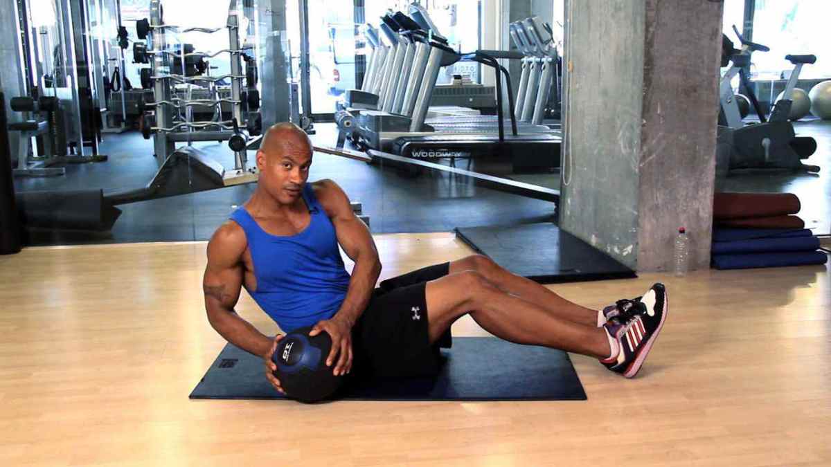 How to Do a Torso Twist at the Gym Howcast