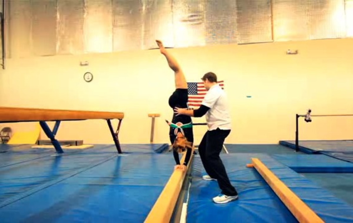 How to Walk on a Balance Beam in Gymnastics Howcast