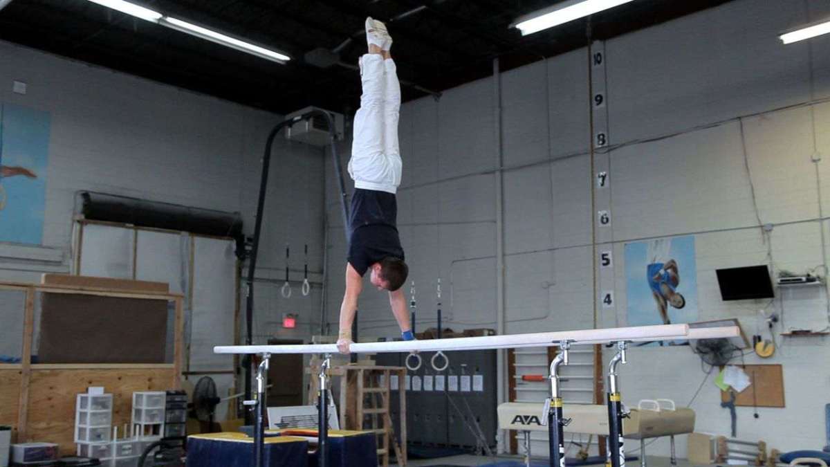 How to Do a Parallel Bars Routine Howcast