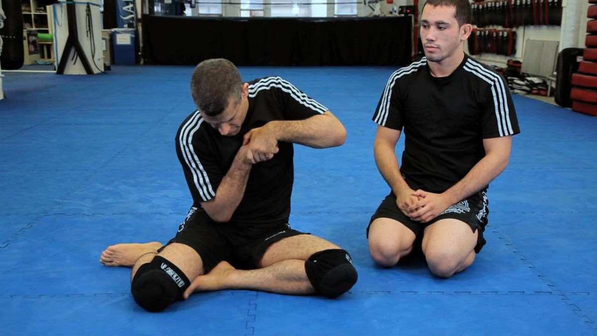 How to Do an Arm In Guillotine Choke Howcast