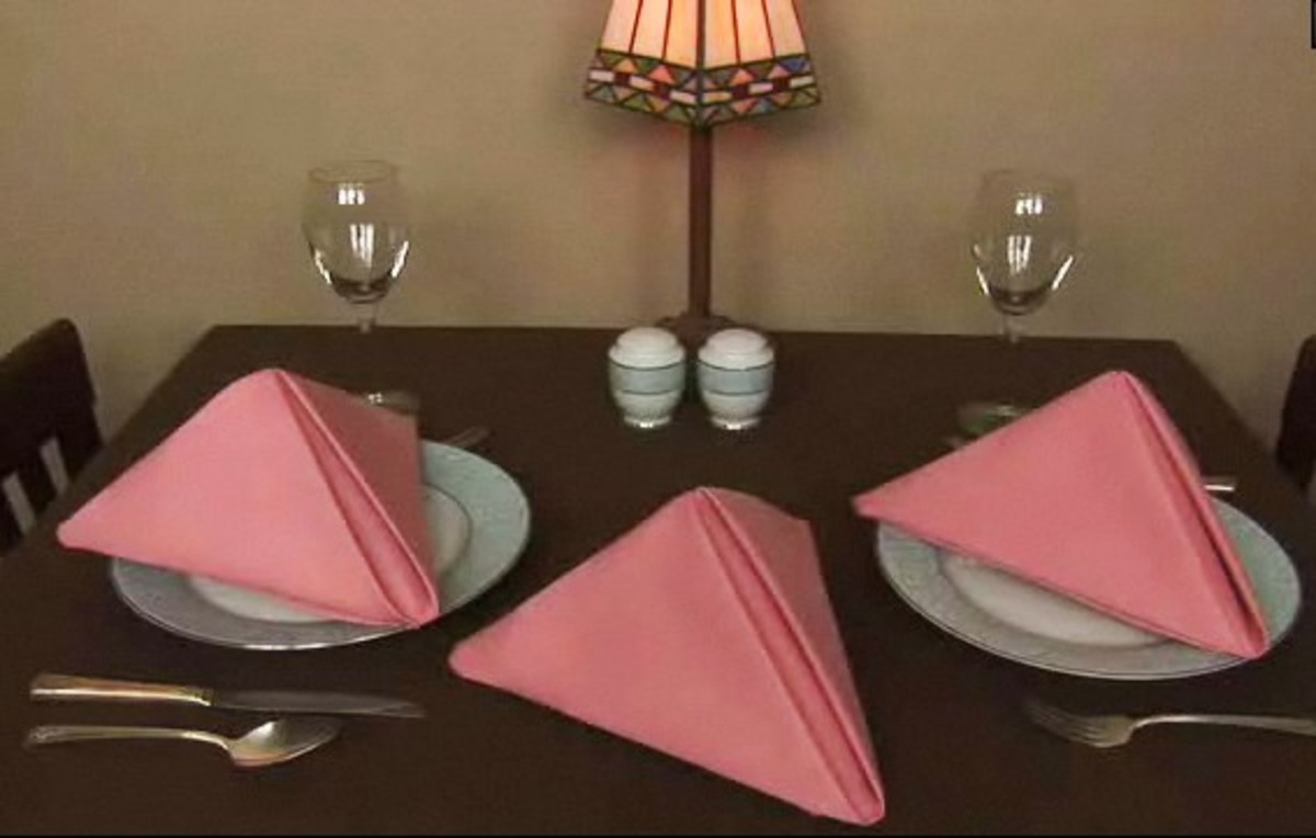 How to Fold Napkins into Pyramid Shapes Howcast