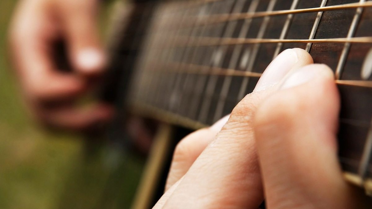 How to Play a HammerOn in Fingerstyle Guitar Howcast