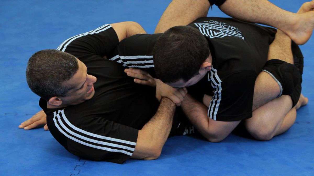 How to Do a Triangle Choke from Guard Using Overhook Howcast