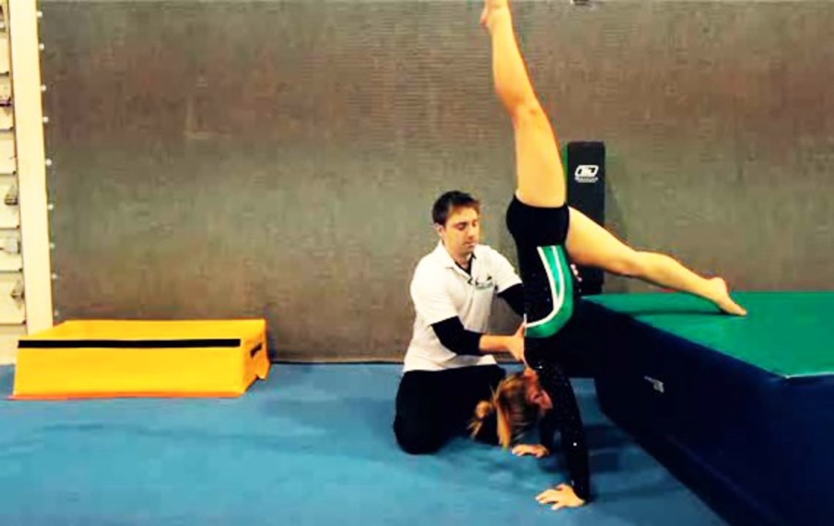 How to Do a Handstand PushUp in Gymnastics Howcast