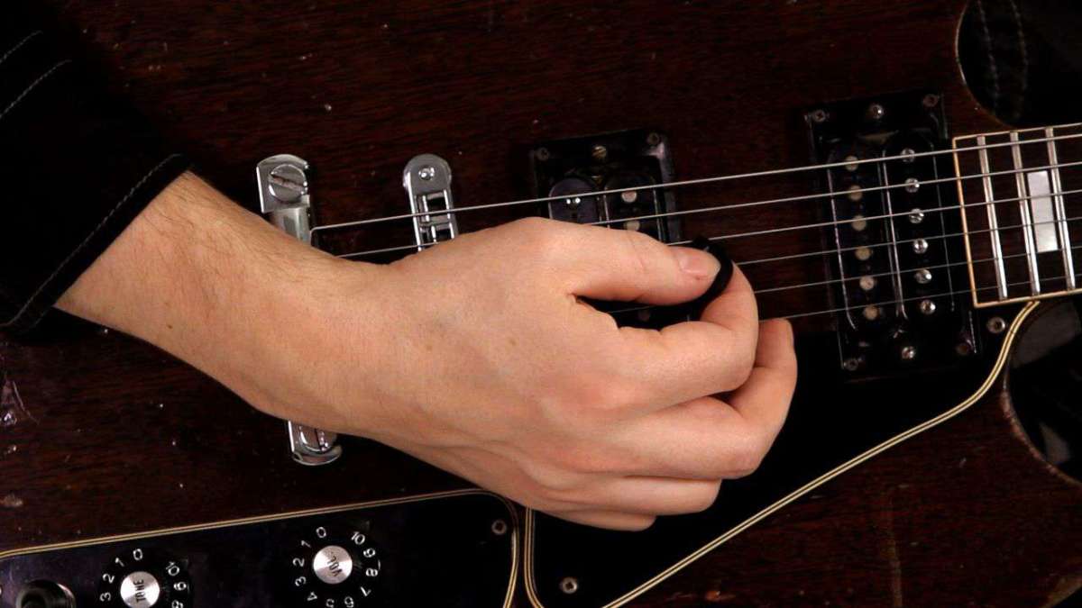 How to Hold a Guitar Pick Correctly Howcast