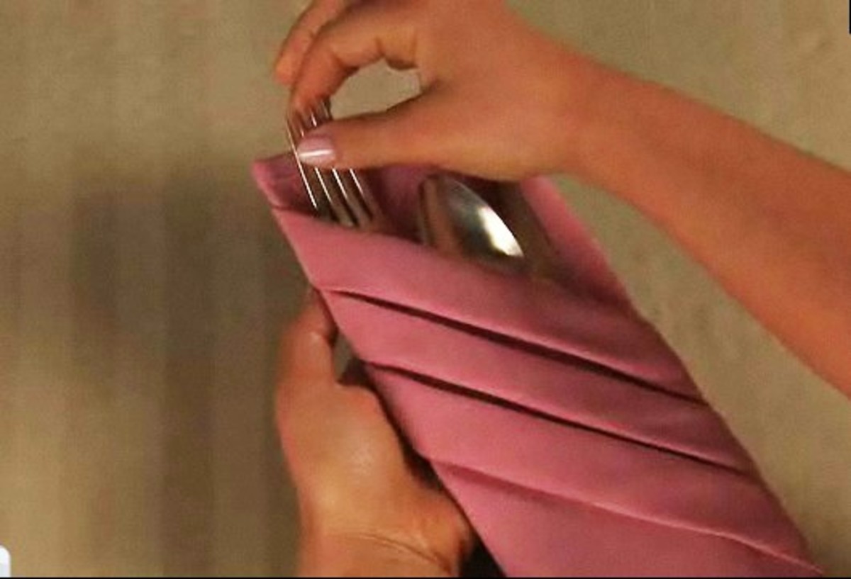How to Fold Napkins into Silverware Pouches Howcast