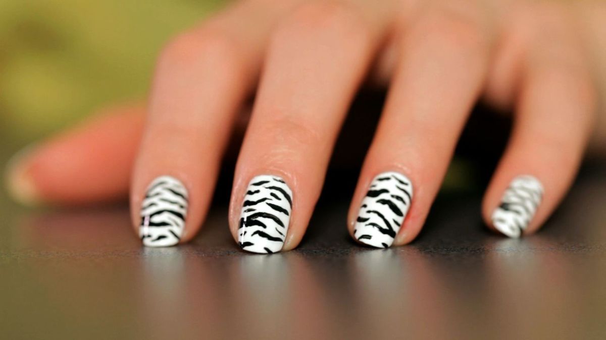 zebra nail design with rhinestones